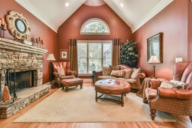 a large kitchen with lot of cabinets and wooden floor