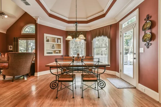 a view of a refrigerator in kitchen and wooden floor