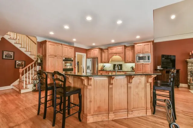 a spacious bedroom with a bed and a large window
