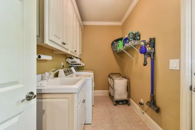 a bedroom with a bed window and a television