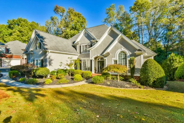 a front view of a house with swimming pool