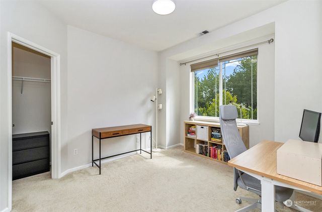 a bedroom with furniture and a window