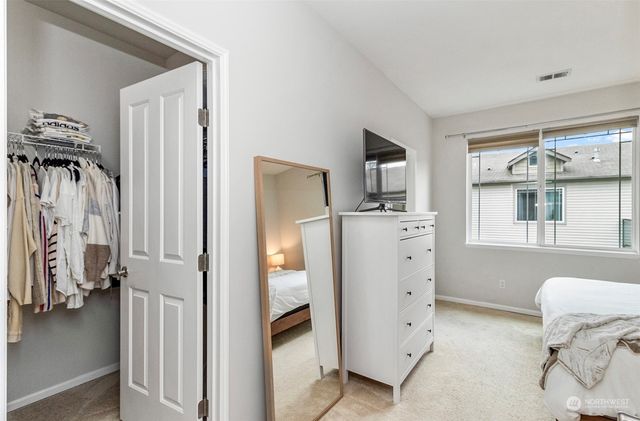 a kitchen with a refrigerator and a sink