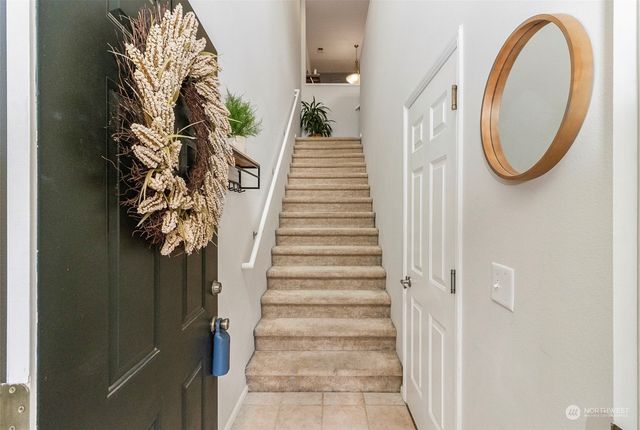 a view of a staircase with white walls