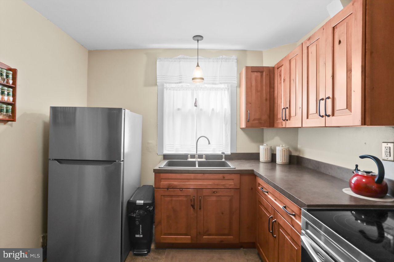 833 Arlington Road York, PA 17403 - Photo 12 of 25 Charming kitchen with warm wood accents.