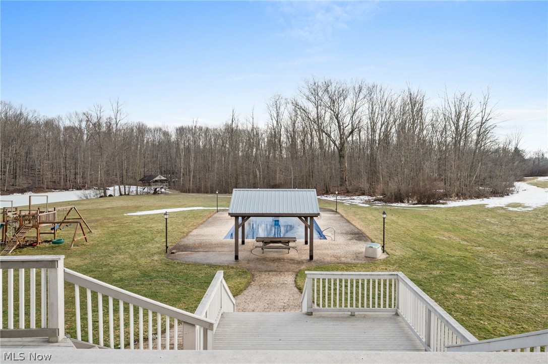 9419 Robinson Road Chardon, OH 44024 - Photo 41 of 46 View of grassy yard with a patio, a playground, in-ground pool and a gazebo