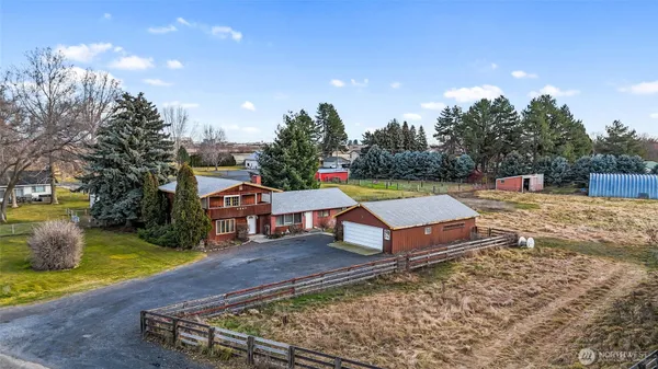 a swimming pool with some trees in the background