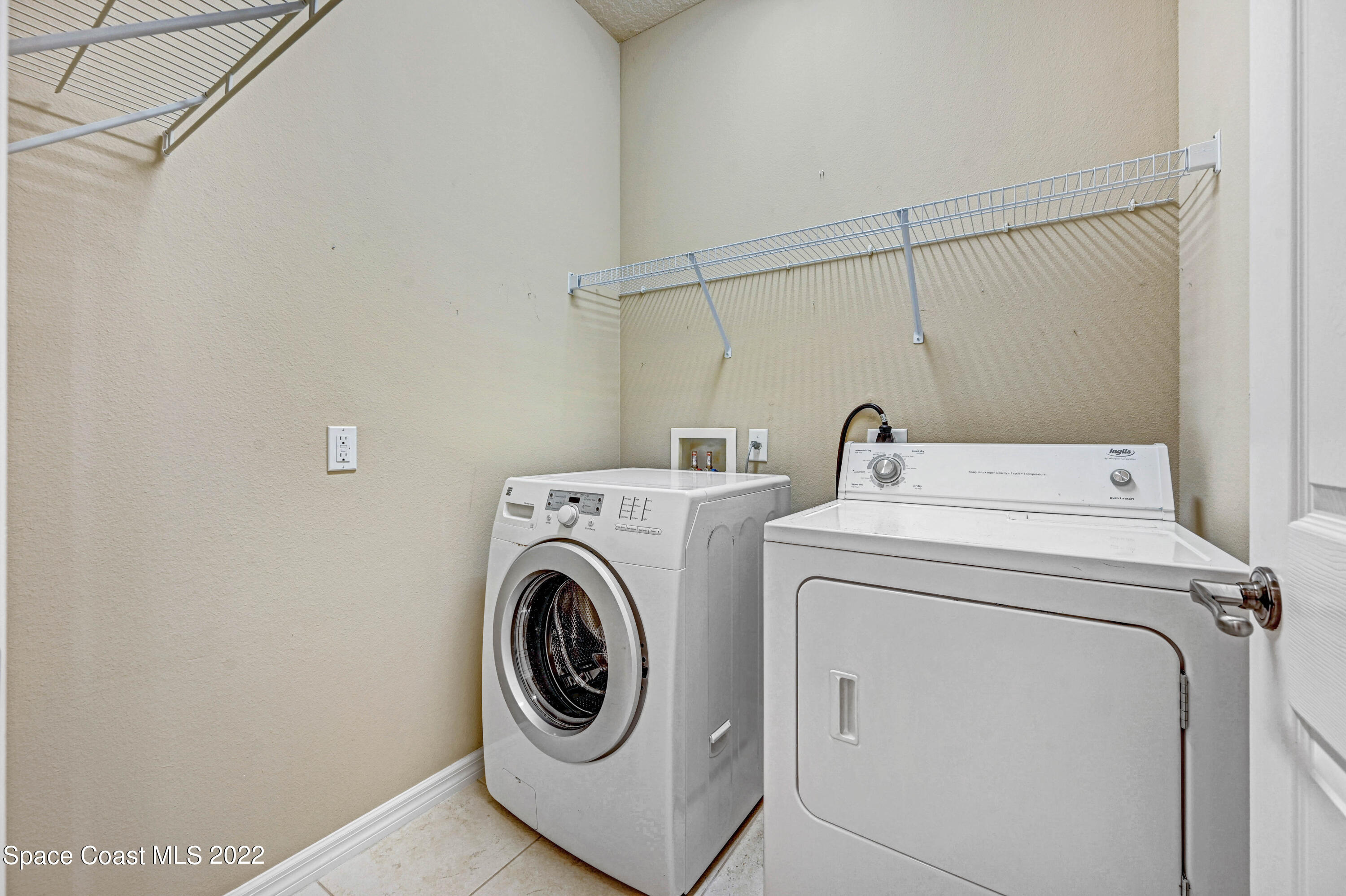2077 Elkins Point Melbourne, FL 32935 - Photo 24 of 31 a utility room with dryer and washer