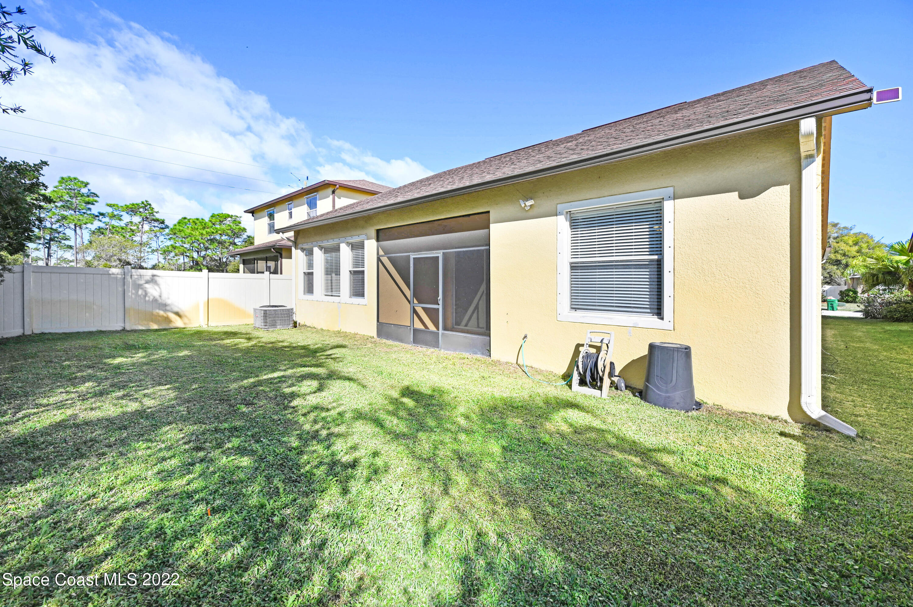 2077 Elkins Point Melbourne, FL 32935 - Photo 28 of 31 a view of a house with backyard and sitting area