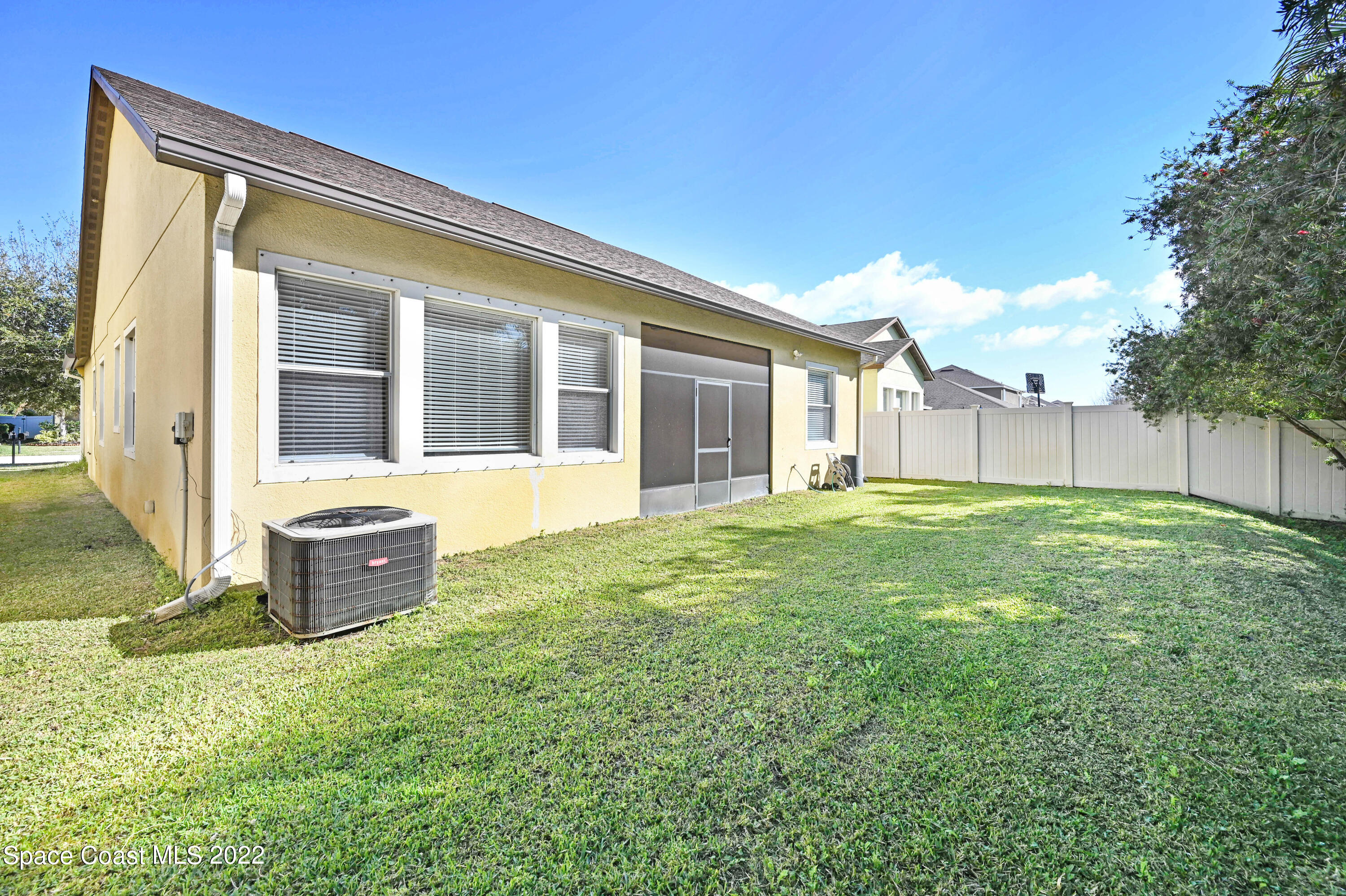 2077 Elkins Point Melbourne, FL 32935 - Photo 29 of 31 a view of a house with backyard and a garden
