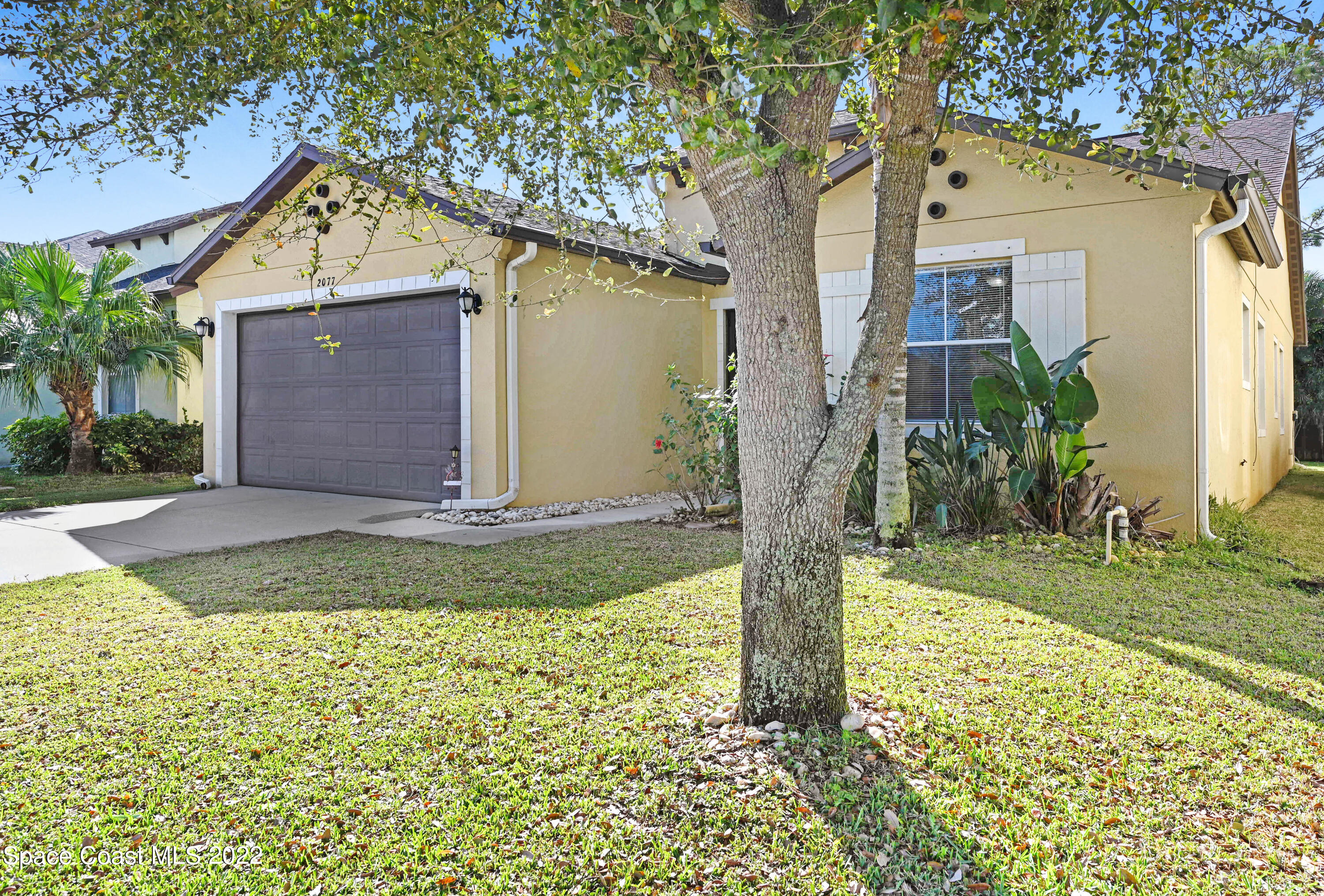 2077 Elkins Point Melbourne, FL 32935 - Photo 31 of 31 a front view of house with yard
