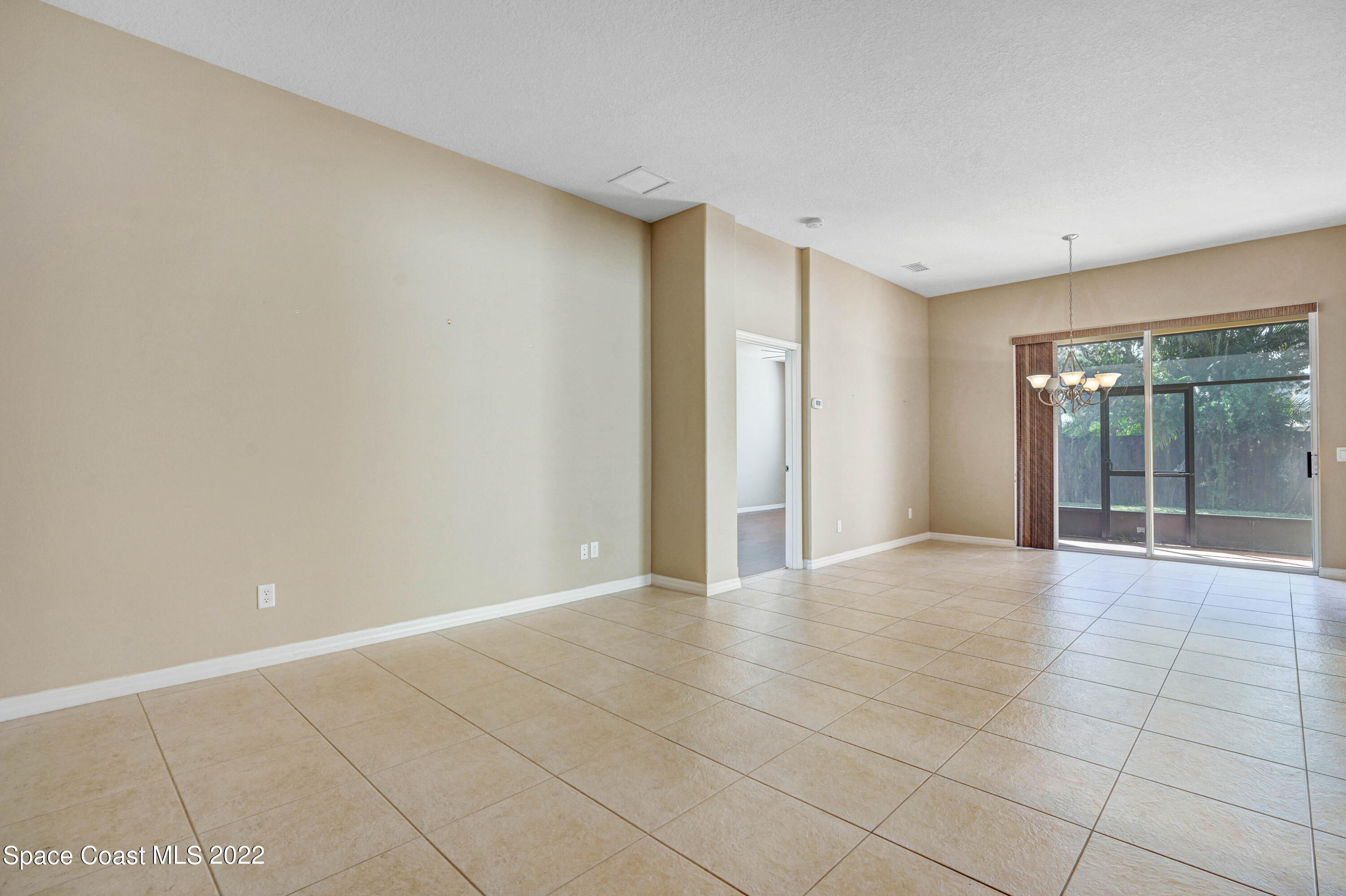 2077 Elkins Point Melbourne, FL 32935 - Photo 4 of 31 a view of an empty room with a window
