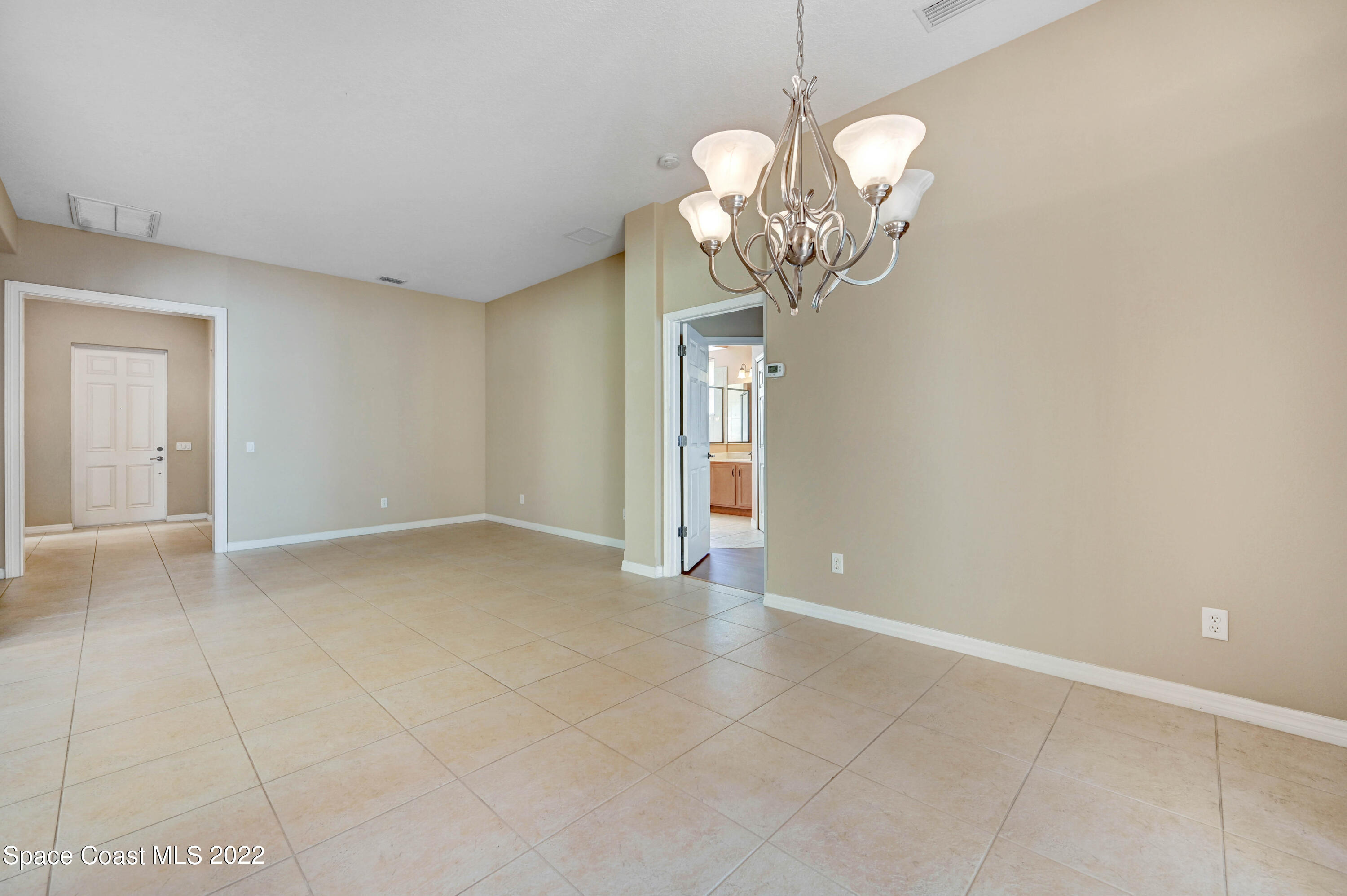 2077 Elkins Point Melbourne, FL 32935 - Photo 8 of 31 a view of a chandelier fan and entryway
