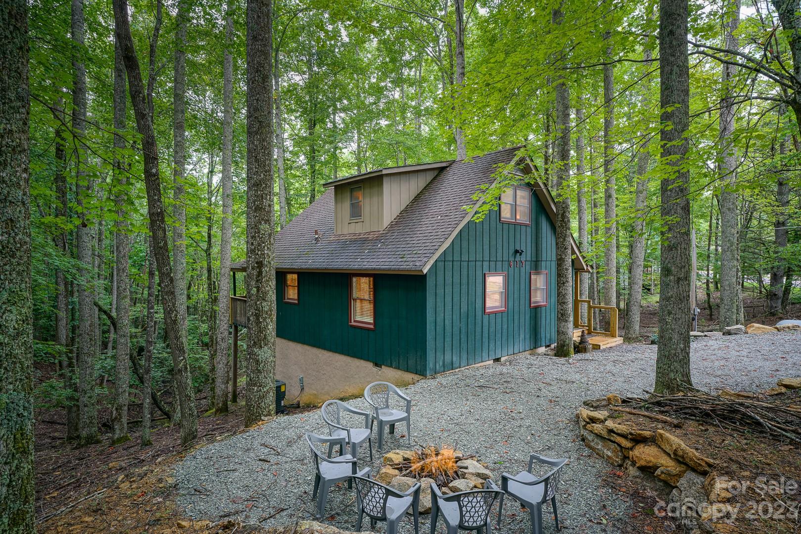 617 Pine Ridge Road Beech Mountain, NC 28604 - Photo 3 of 20 a front view of a house with a yard