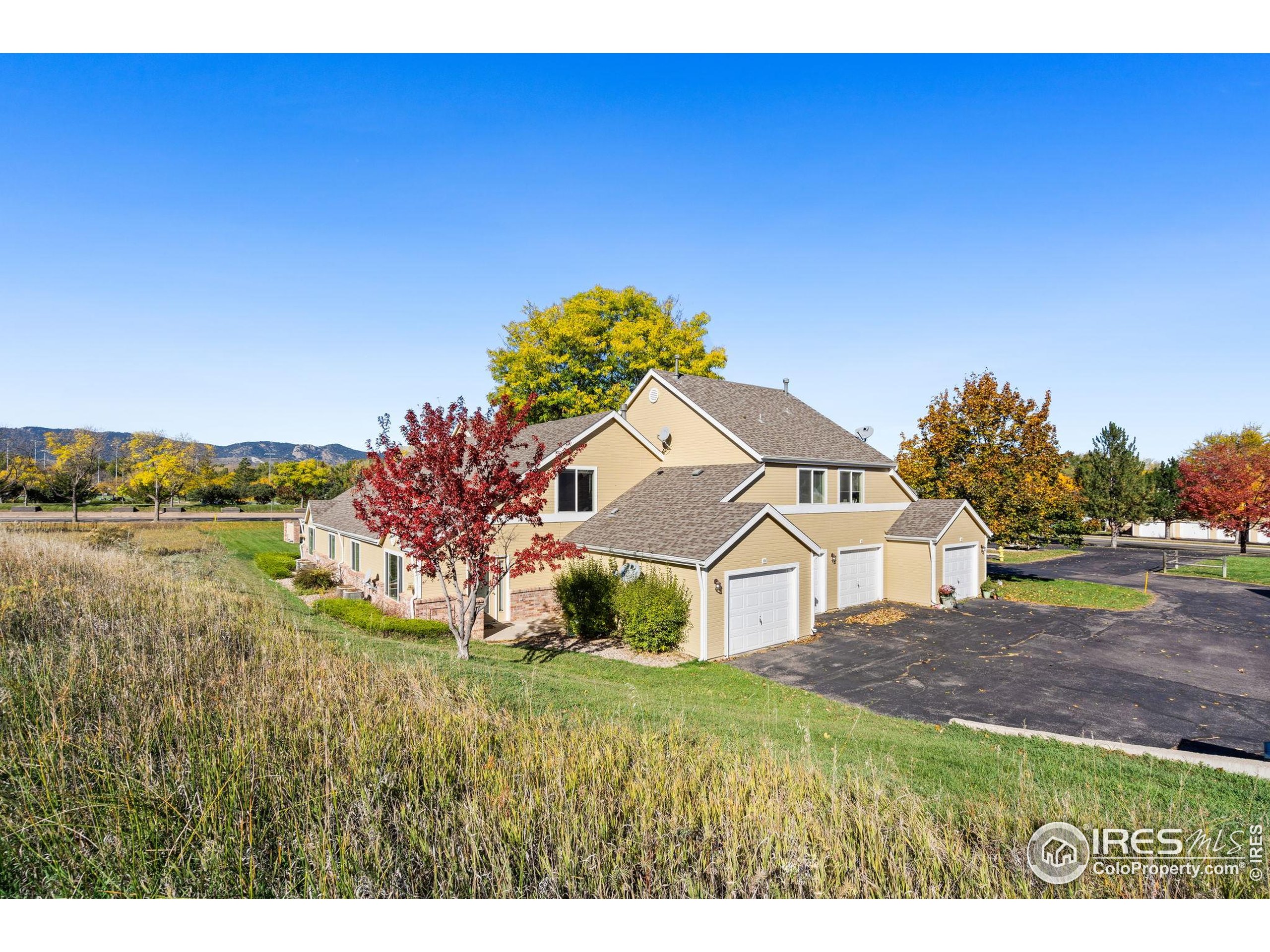 1021 Rolland Moore Drive, Unit F Fort Collins, CO 80526 - Photo 1 of 29 a view of a house with a yard