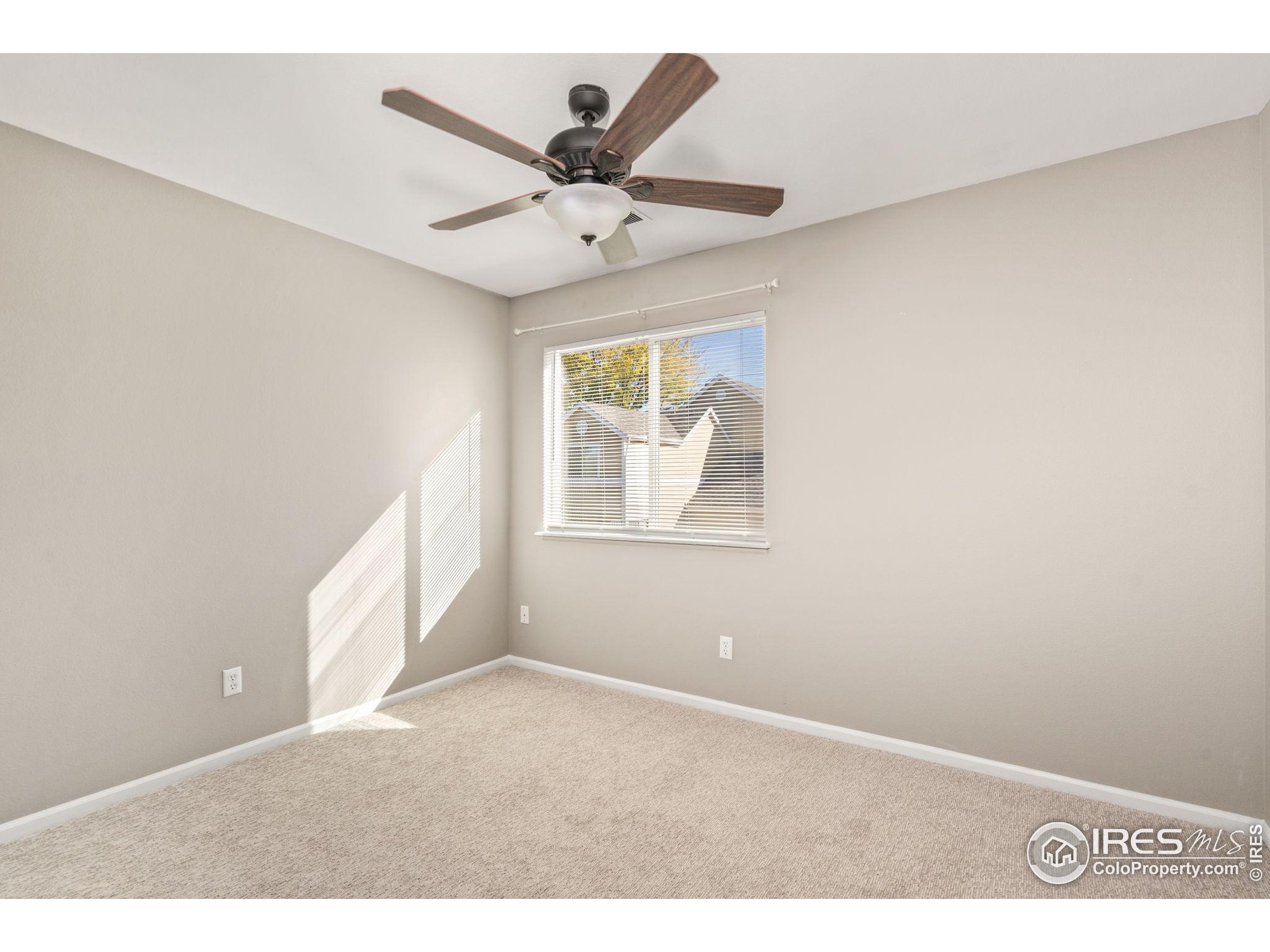 1021 Rolland Moore Drive, Unit F Fort Collins, CO 80526 - Photo 18 of 29 a view of an empty room with a window