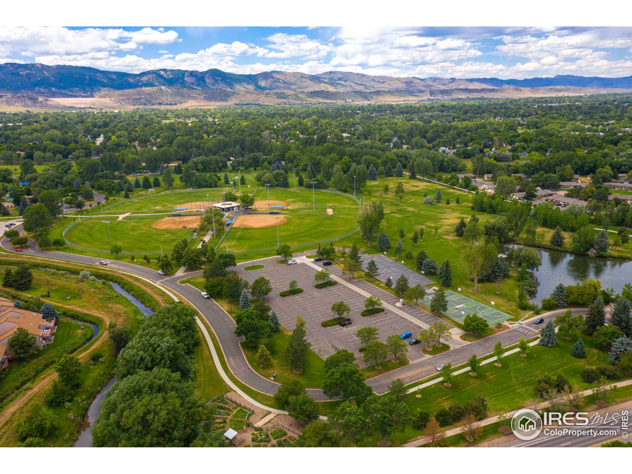 1021 Rolland Moore Drive, Unit F Fort Collins, CO 80526 - Photo 25 of 29 a view of a city with mountains in the background