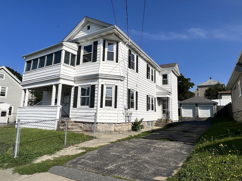 1590 Slade Street Fall River, MA 02721 - Photo 1 of 35 a front view of a house with a yard
