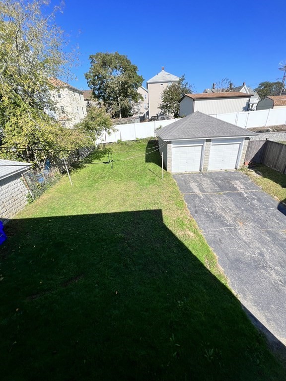 1590 Slade Street Fall River, MA 02721 - Photo 11 of 35 a view of a house with a yard