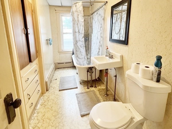1590 Slade Street Fall River, MA 02721 - Photo 15 of 35 a bathroom with a sink a toilet and mirror