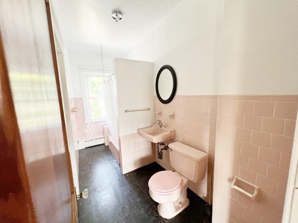 1590 Slade Street Fall River, MA 02721 - Photo 21 of 35 a bathroom with a sink and a mirror