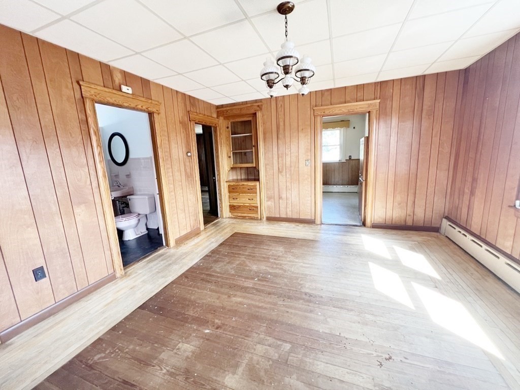 1590 Slade Street Fall River, MA 02721 - Photo 26 of 35 a view of a hallway with wooden floor and stairs