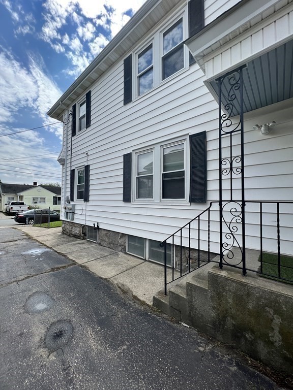 1590 Slade Street Fall River, MA 02721 - Photo 5 of 35 a view of a house with a yard