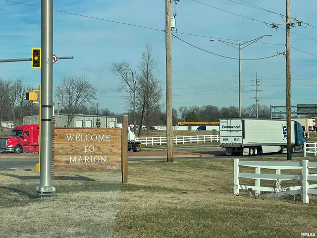 a view of a park with welcome board