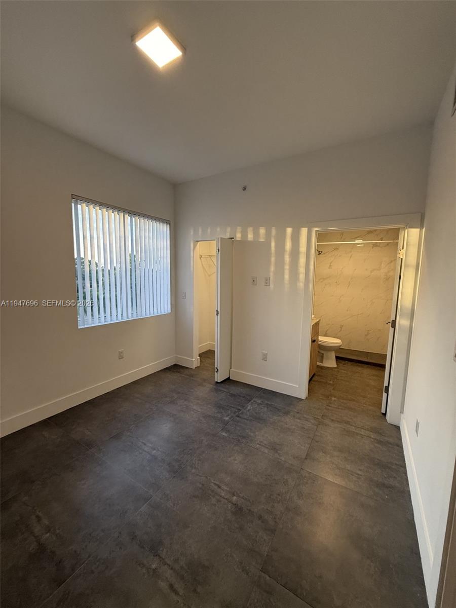 2010 Southwest 25th Terrace, Unit 302 Miami, FL 33133 - Photo 11 of 16 an empty room with windows