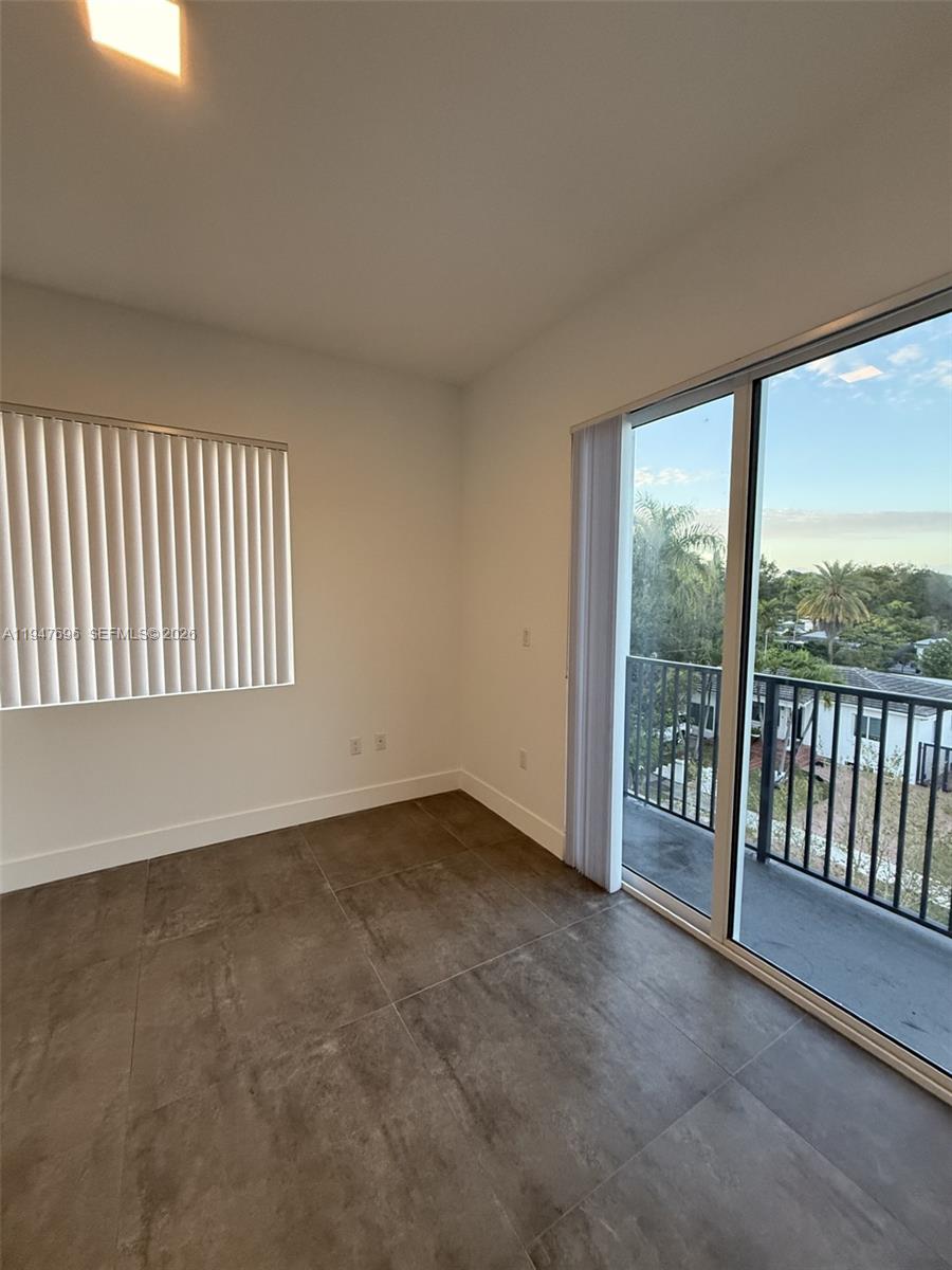 2010 Southwest 25th Terrace, Unit 302 Miami, FL 33133 - Photo 12 of 16 an empty room with windows