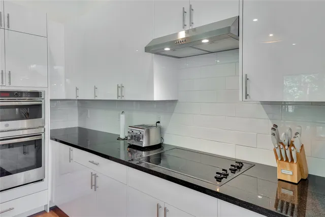 a reading room with furniture and a window