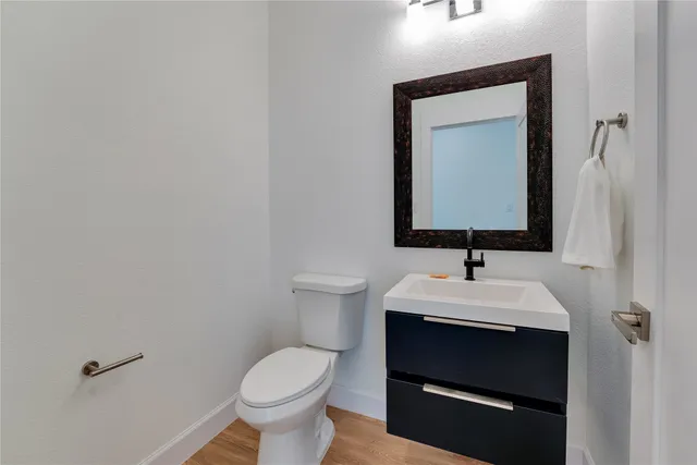 a spacious bathroom with a bathtub a sink and a mirror