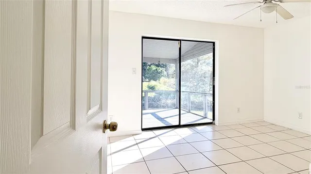 a view of a glass door and a window in a room
