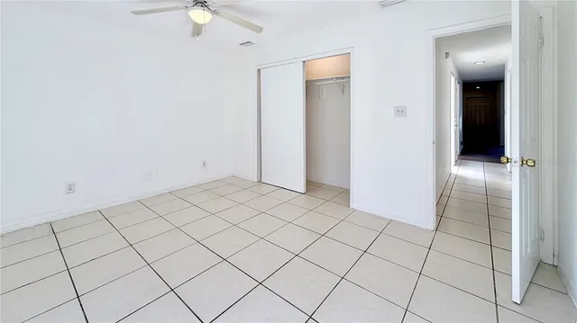 an empty room with fan