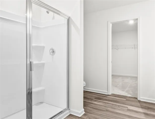 a bathroom with a glass shower door