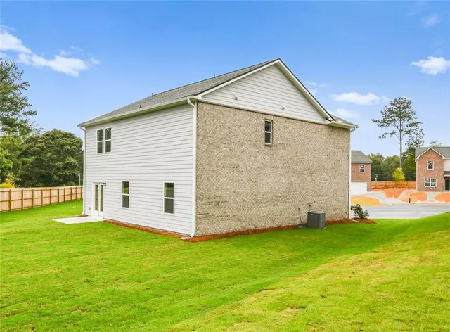 a view of a backyard with a garden and plants