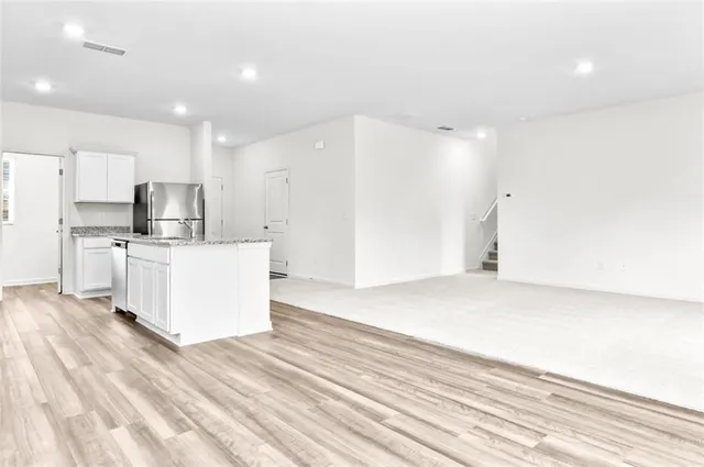 a view of kitchen with wooden floor