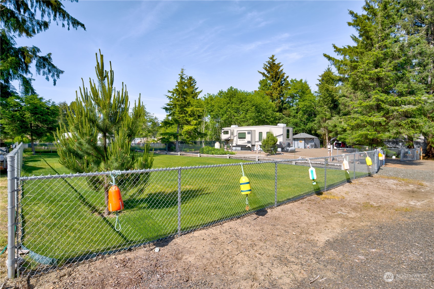 a view of a park with iron fence