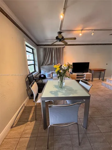 a spacious bedroom with a large bed and a couch