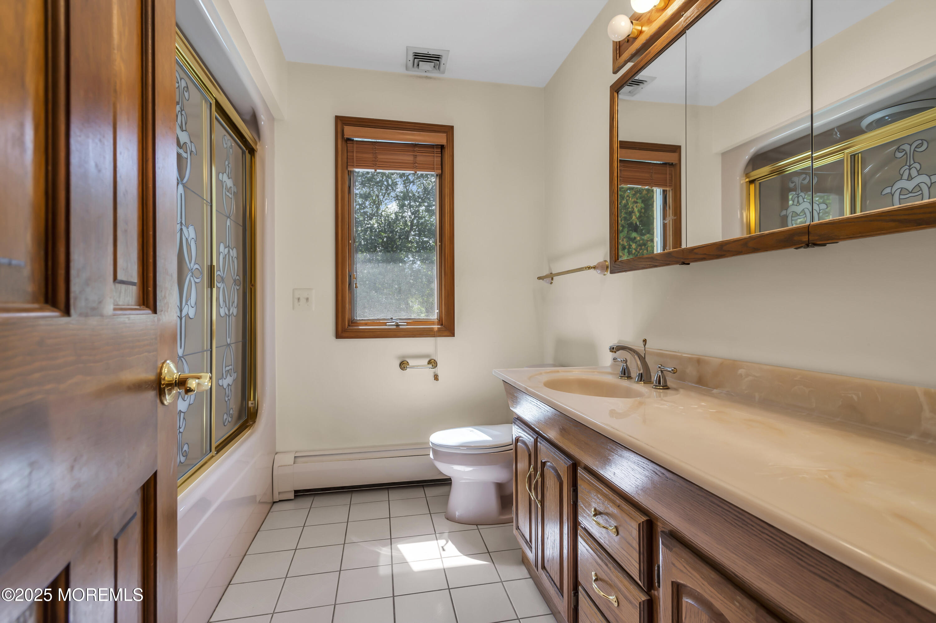 1350 Church Road Toms River, NJ 08755 - Photo 27 of 42 a bathroom with a granite countertop sink a toilet and a mirror