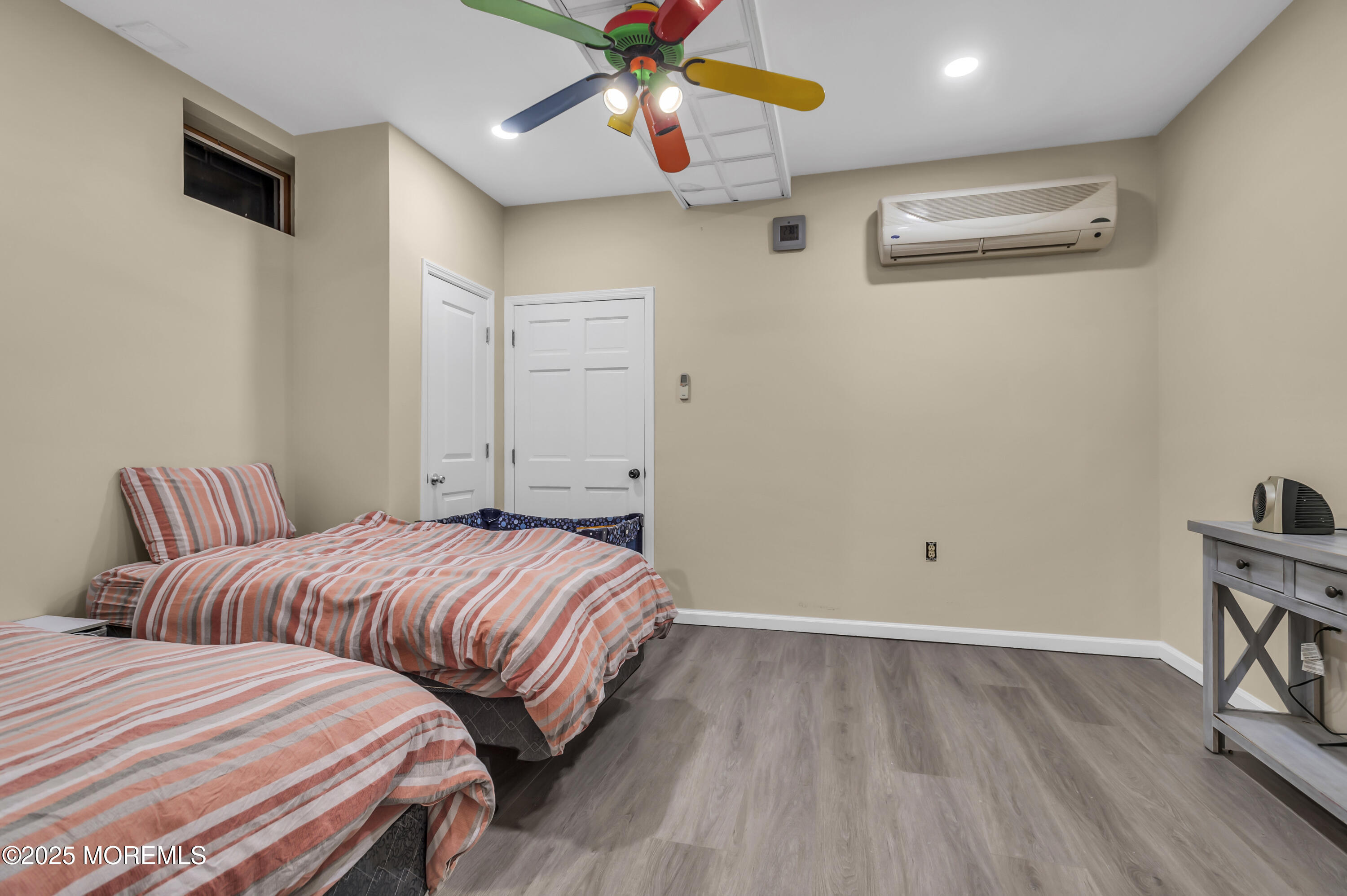 1350 Church Road Toms River, NJ 08755 - Photo 37 of 42 a bedroom with two beds and a chandelier