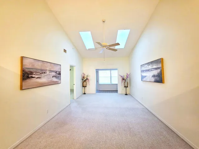 a view of a hallway with a large window
