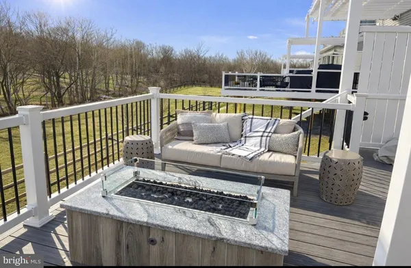 a view of a roof deck with couches