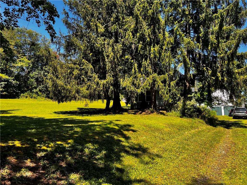 5650 Aiken Road McKees Rocks, PA 15136 - Photo 5 of 16 a view of swimming pool with an outdoor space and seating area