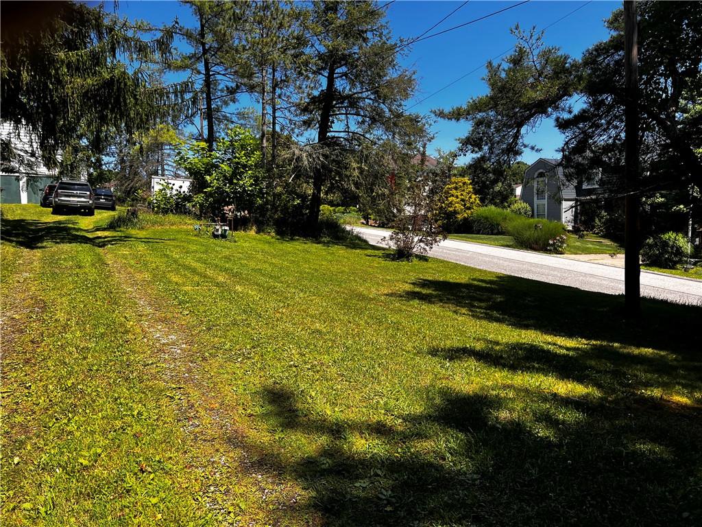 5650 Aiken Road McKees Rocks, PA 15136 - Photo 6 of 16 a view of yard with swimming pool and trees in the background