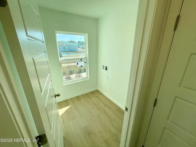 a kitchen with stainless steel appliances kitchen island granite countertop a stove a sink a microwave and a dining table