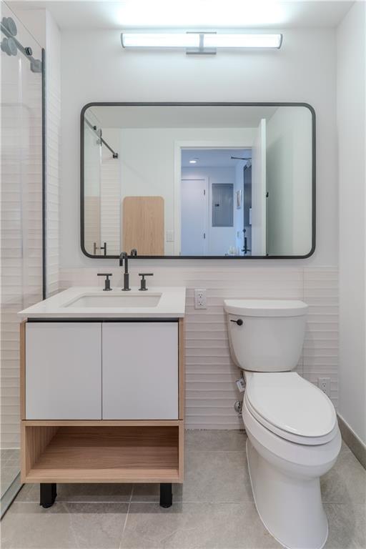 1807 66th Street, Unit 4C Brooklyn, NY 11204 - Photo 11 of 14 a bathroom with a toilet sink and mirror