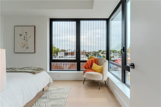 a bedroom with furniture and a window