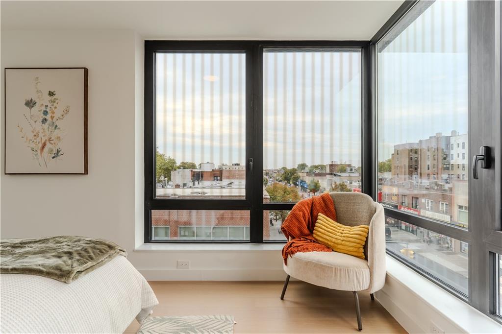 1807 66th Street, Unit 4C Brooklyn, NY 11204 - Photo 7 of 14 a bedroom with a bed and a large window with outer view