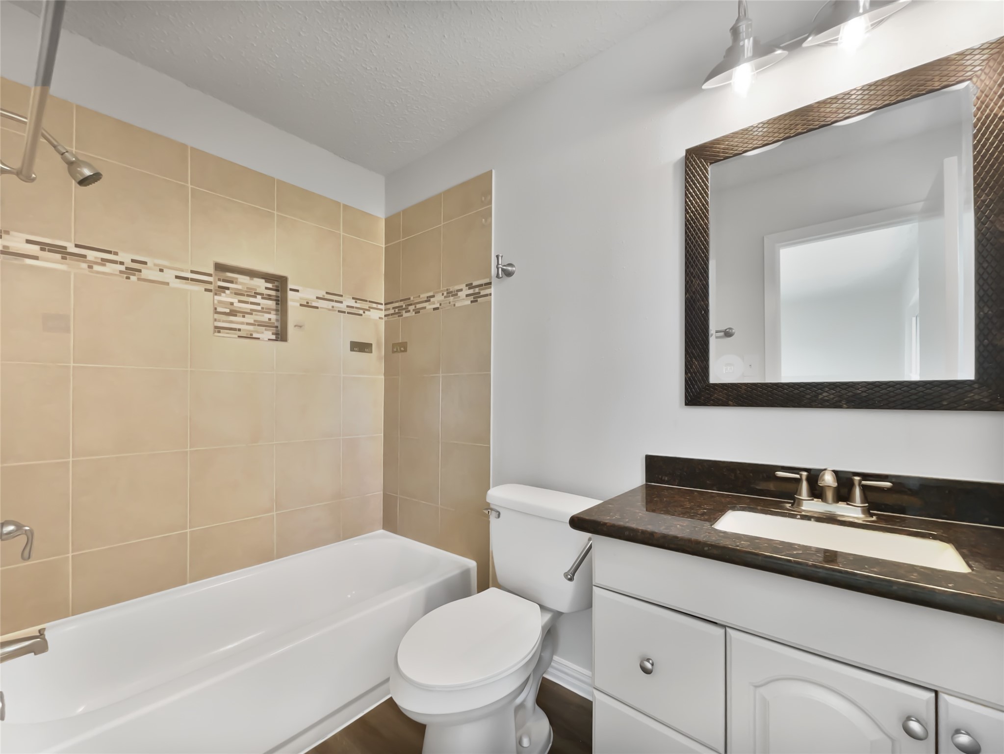 5414 Honeybear Lane Spring, TX 77373 - Photo 15 of 16 a bathroom with a sink toilet vanity and shower